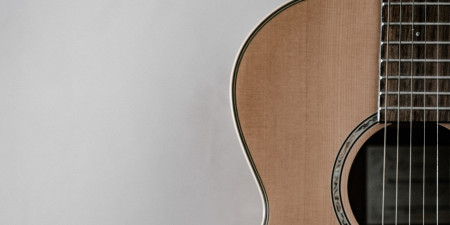 A brown acoustic guitar