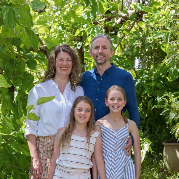 Bill and Kate outside and smiling with their children Alice and Edie