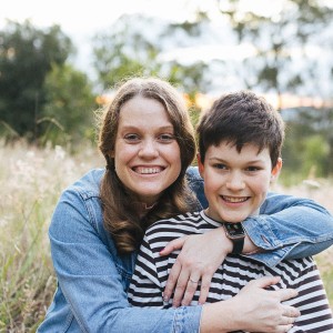 Lauren smiling with her son.