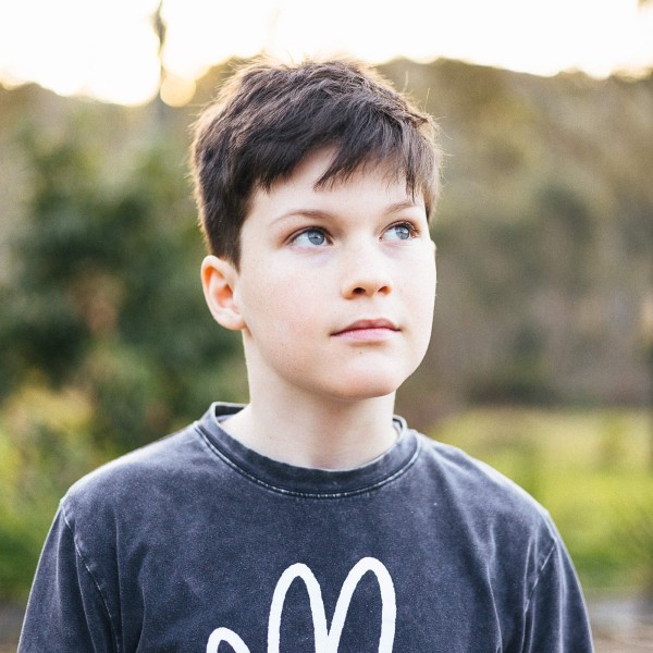 Lior in his backyard, looking thoughtfully up to the sky