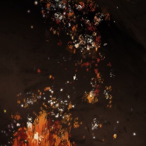Embers of a bonfire rocketing up into the night sky