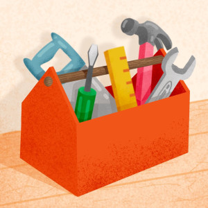 A red toolbox full of tools sitting on a wooden workbench.