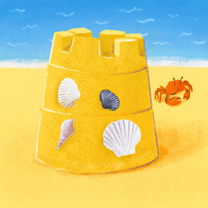 A sandcastle with shells, and a crab in the background, at the beach.