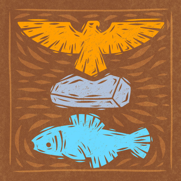 A woodcarving of an eagle, a rock and a fish