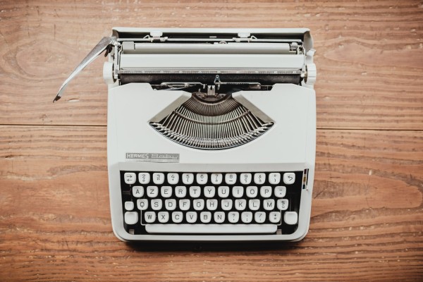 An old typewriter on a table.